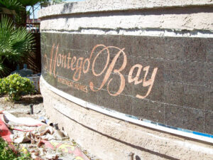 sandblasted stone entry way wall